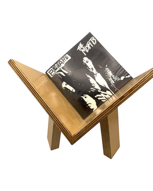 Leopold Woodworks Full Tilt Vinyl Display in Baltic birch holding a Misfits record at an angled browsing position.